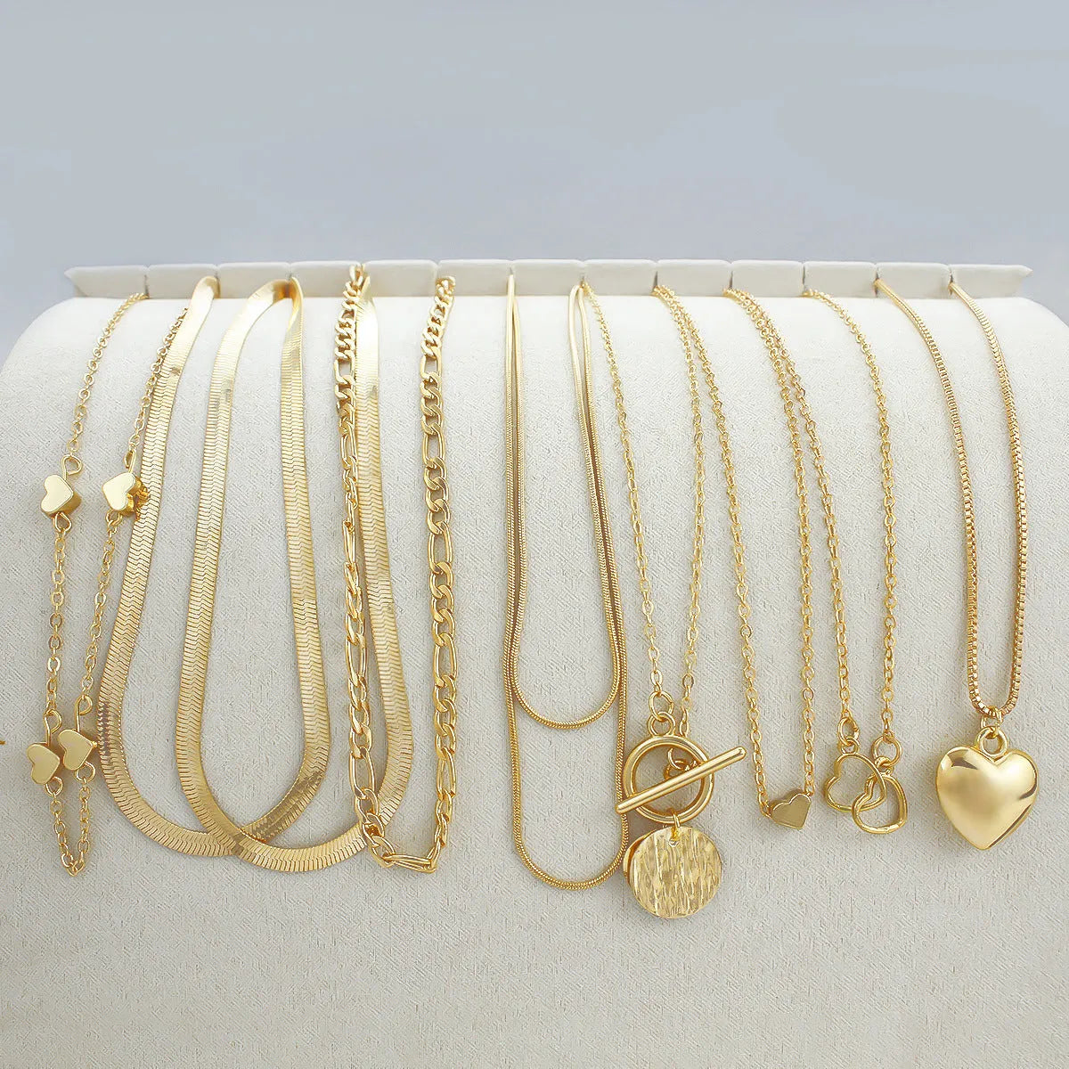 Women's gold necklace set with 10 alloy pendants on adjustable snake bone chain