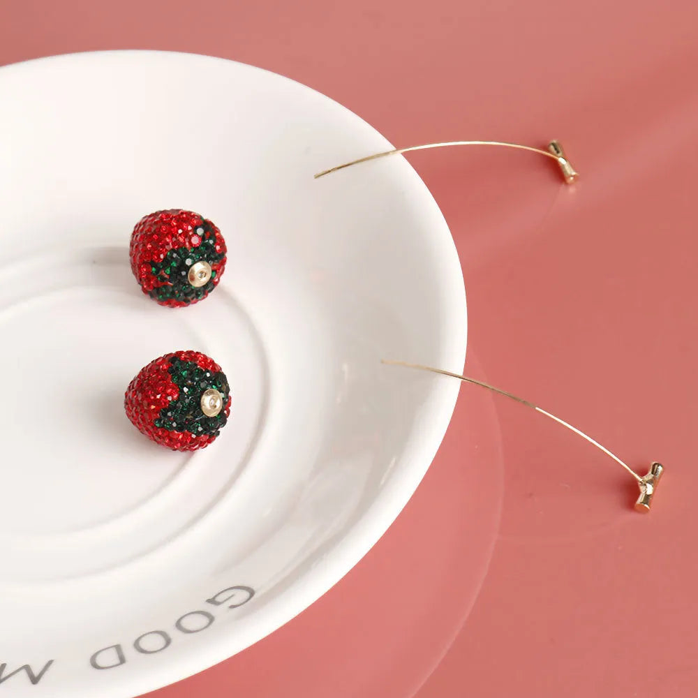Geometric strawberry design earrings with spot drill detailing in red zinc alloy