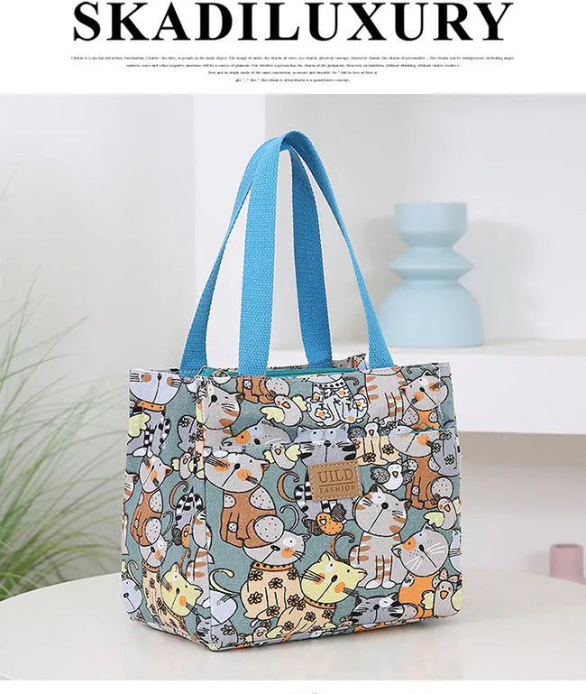Women's printed canvas handbag with aluminium hardware in a selection of floral and animal designs.