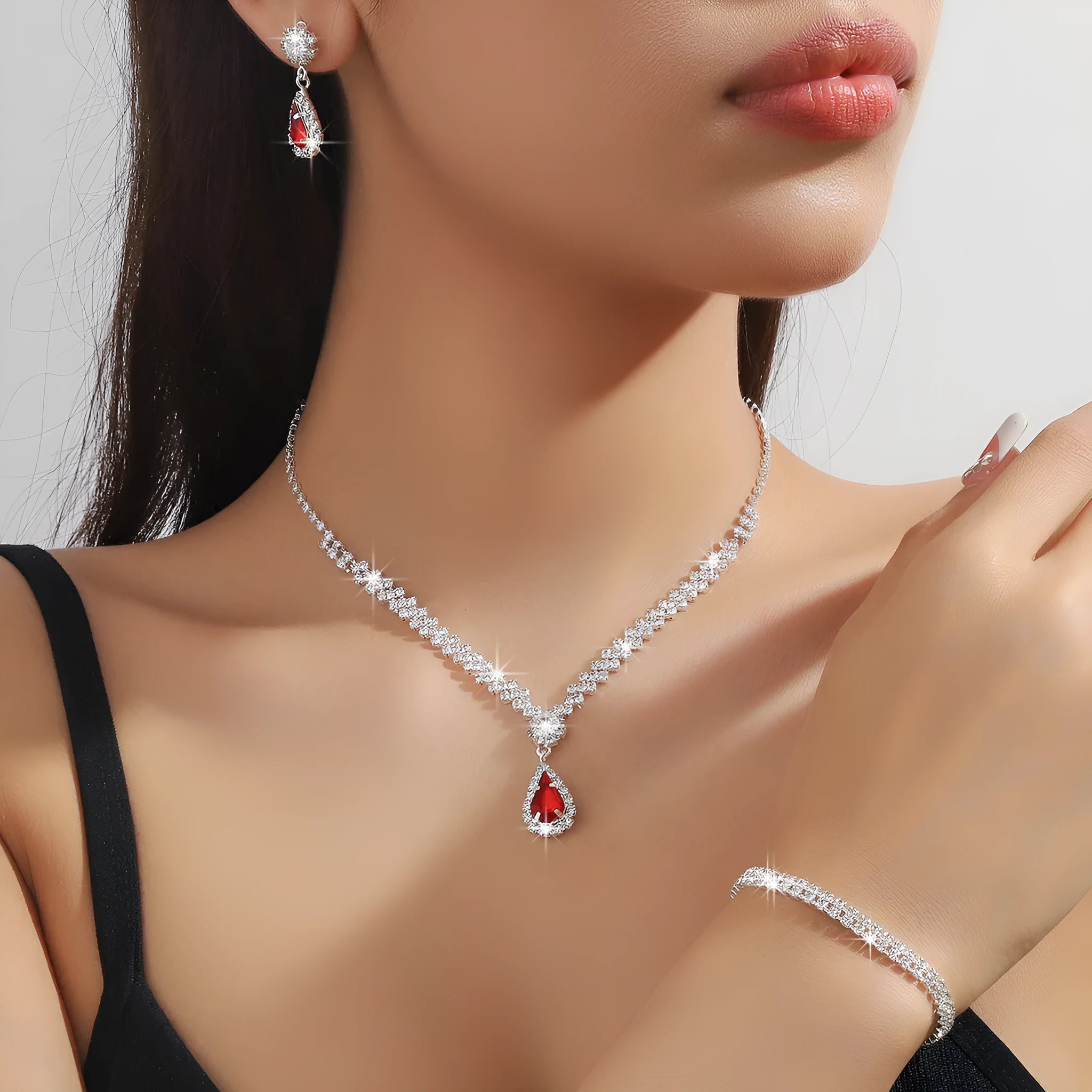 Rhinestone claw chain necklace and earrings set with water drop shape, available in multiple colours for women.