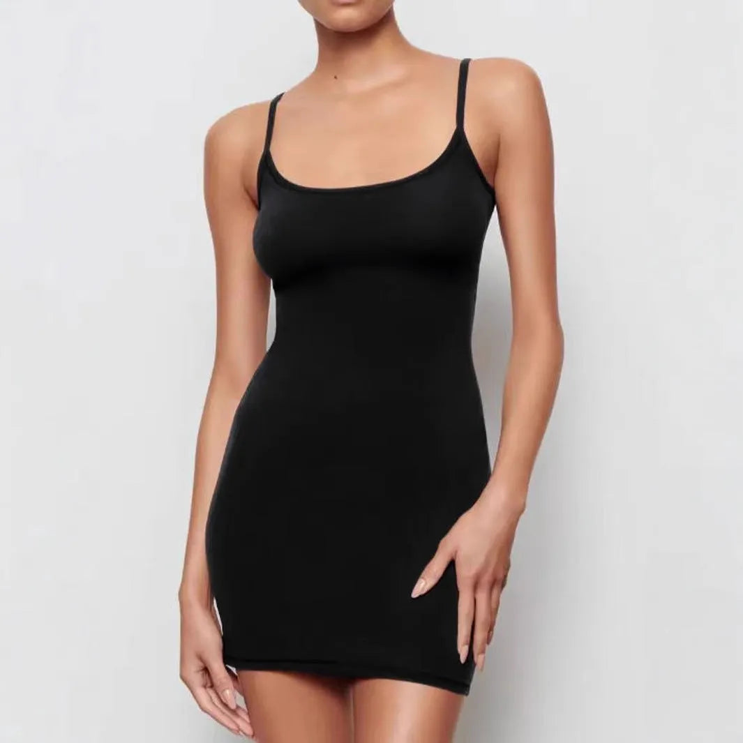 Black skinny sheath sling dress with sleeveless design on a mannequin.