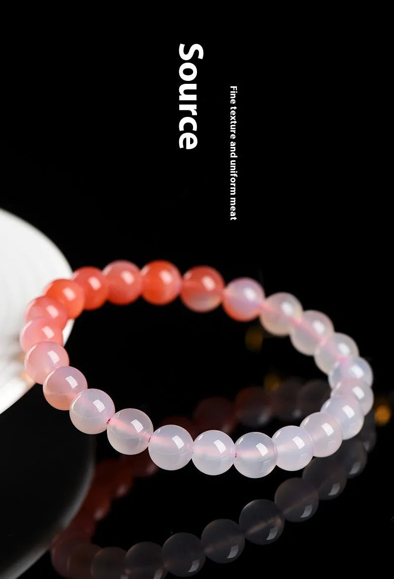 Natural gradient Yanyuan agate bracelet in geometric single-circle design on a neutral background.