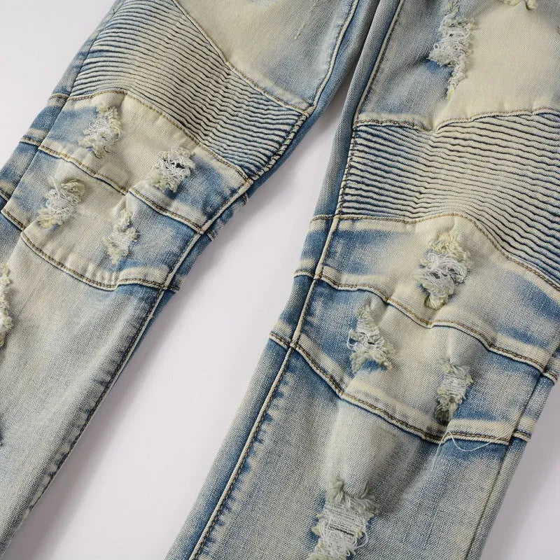 Men's light blue distressed slim fit jeans with hand-frayed detailing and stretch denim fabric