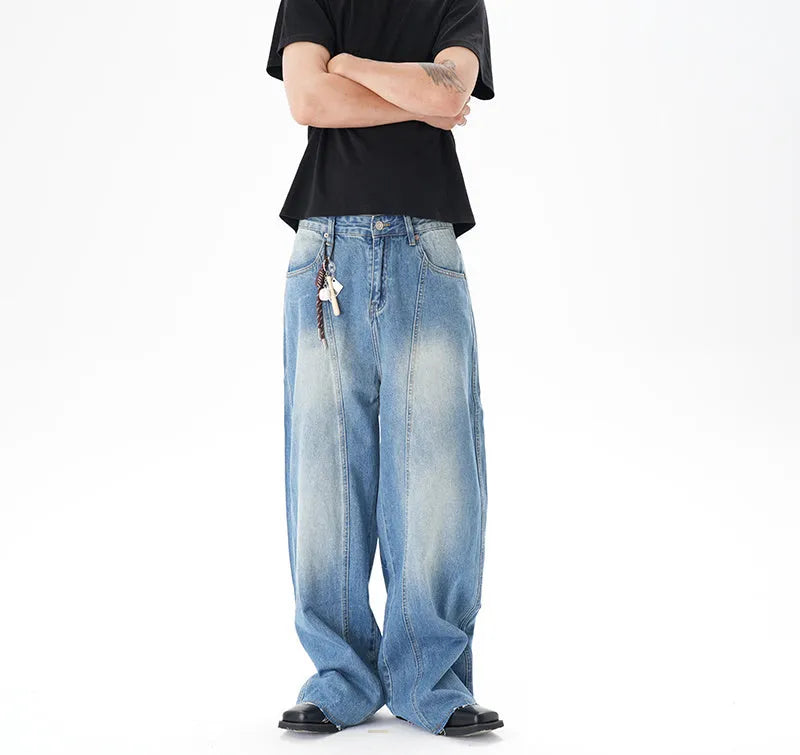 Light blue vintage washed wide leg machete jeans with zip fly on a model
