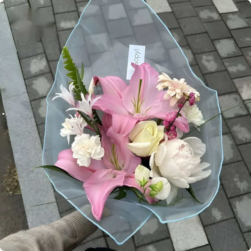 Silk bouquet wrap fabric 60x60cm in grey, folded on a table with white flowers