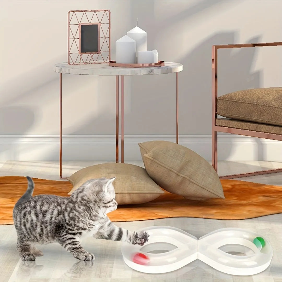 Blue and white cat toy set with a turntable track ball and a teasing stick on a floor.