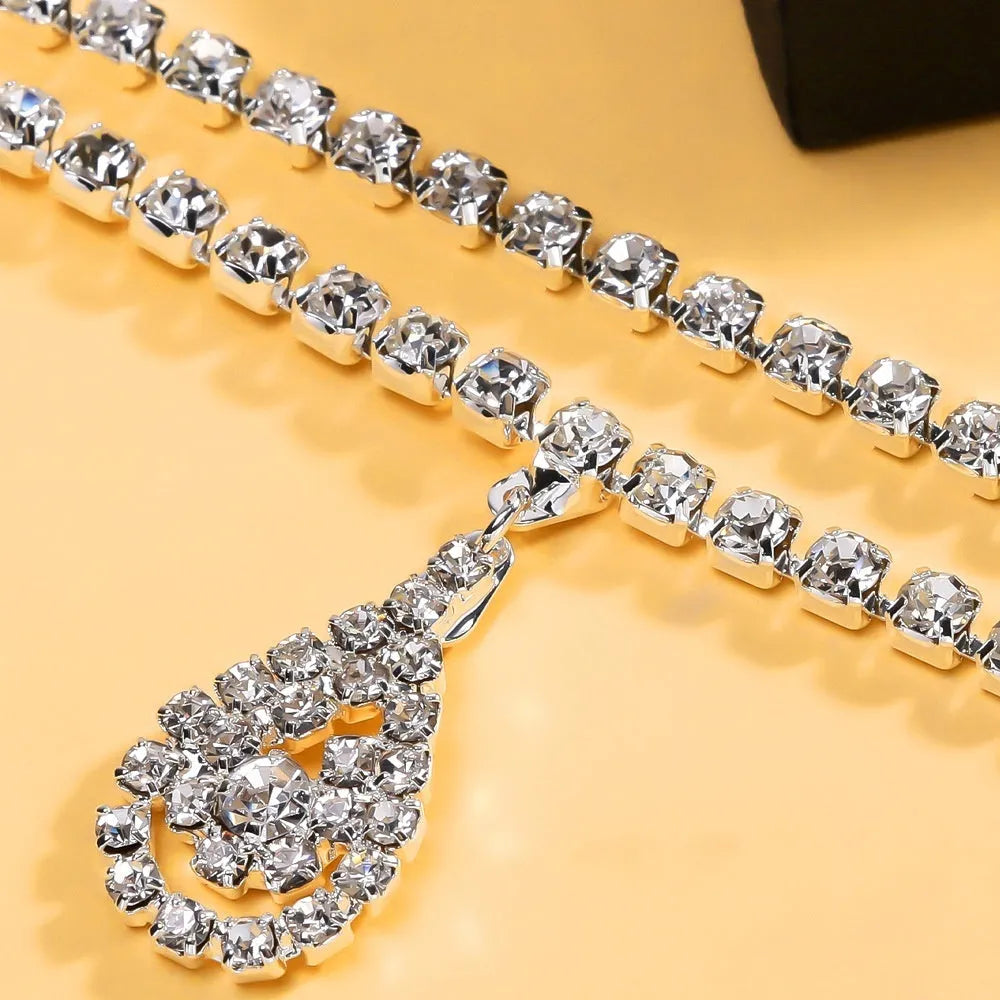 Gold women's waist chain with water drop rhinestone pendant and lobster buckle closure