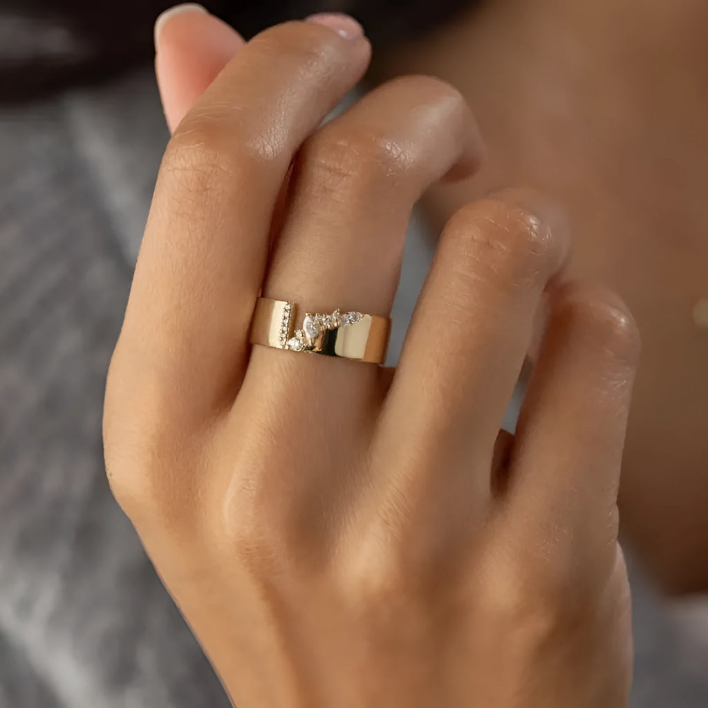 Gold electroplated women's ring with a central zircon stone, shown in size options 6 to 10.