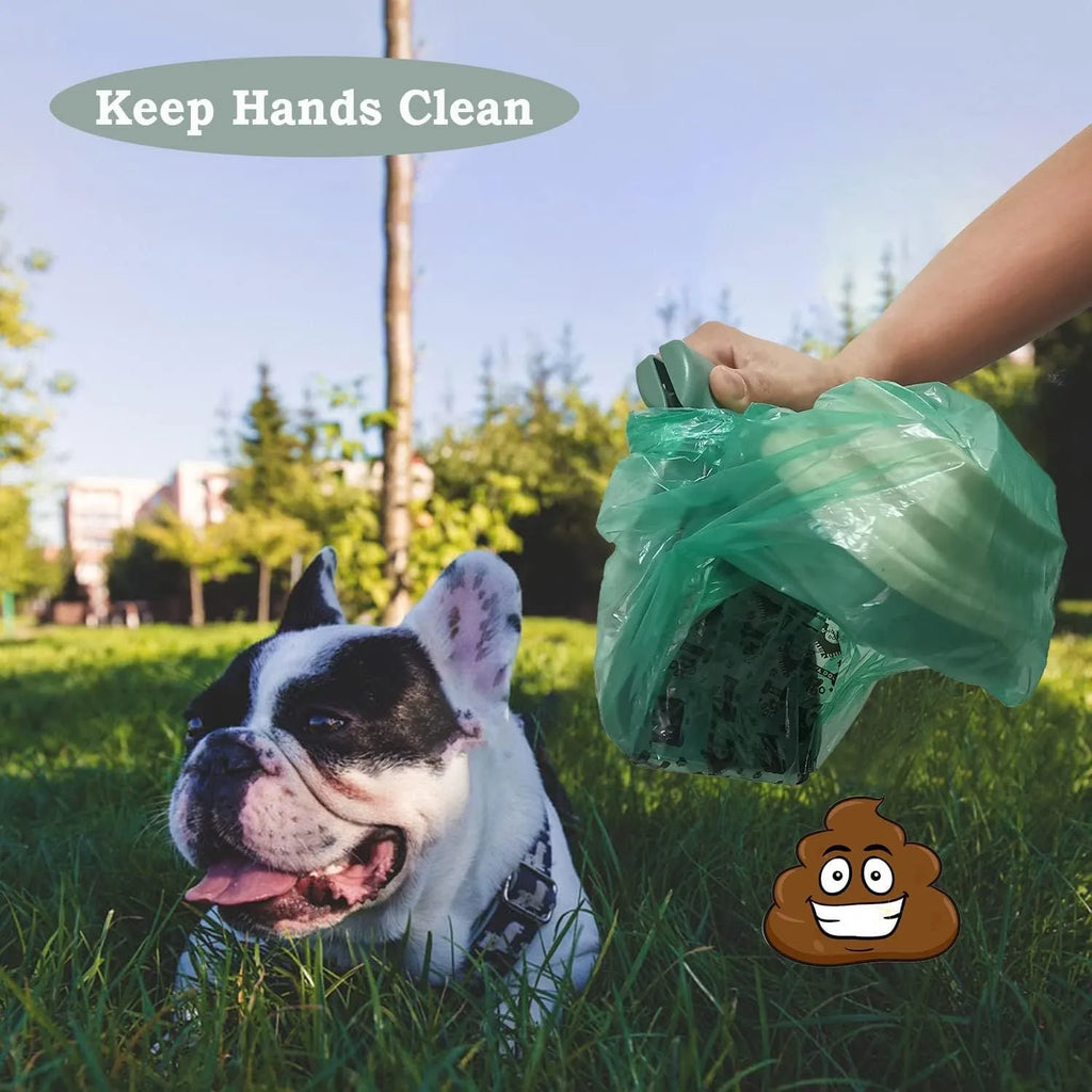 Blue handheld dog poop scooper with expandable container and integrated bag dispenser, shown with a carabiner clip.