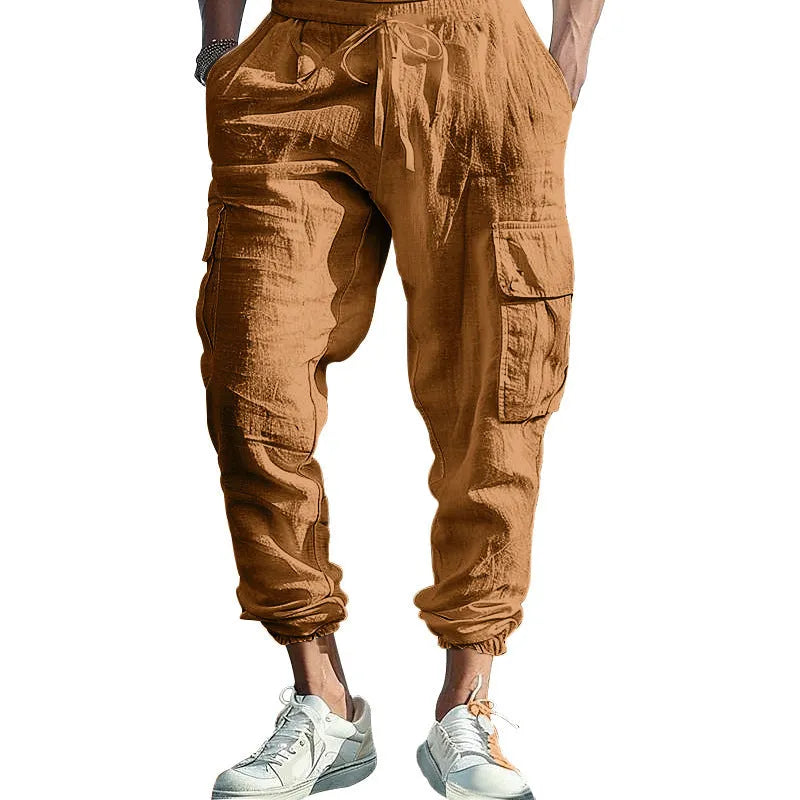 Men's loose-fit linen trousers with ankle ties and multiple pockets in Army Green.