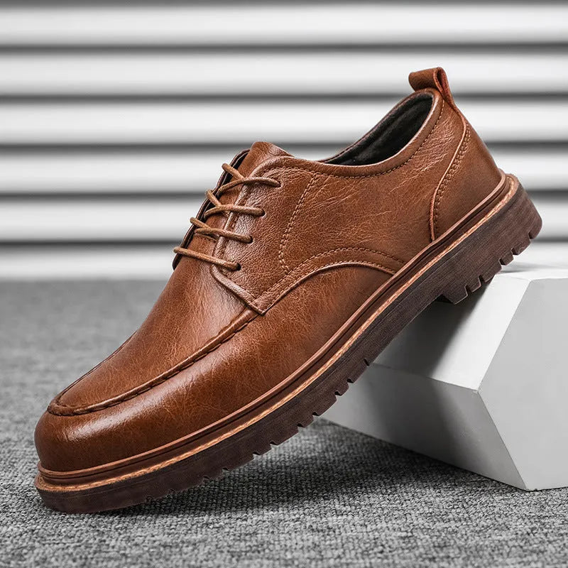 Men's tooling casual leather shoes in black, round toe low top with stitching details on rubber sole