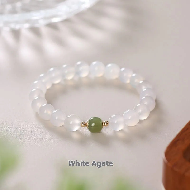 Natural white agate crystal bracelet with cinnabar inlay and text detail, handmade, 6mm and 8mm beads
