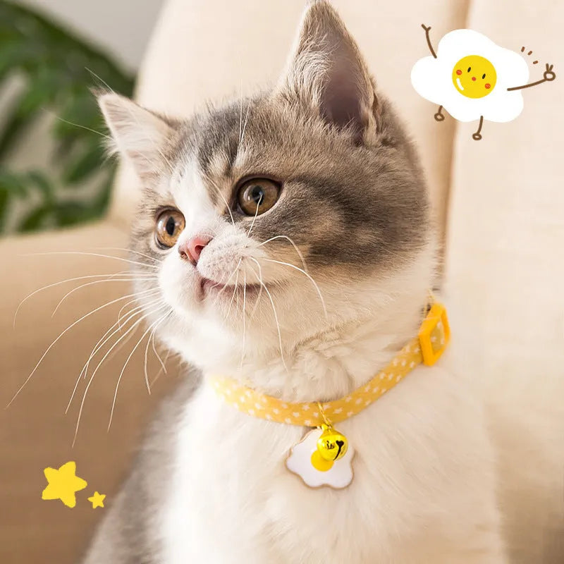 Adjustable cat collar with bell pendant and bow tie accessory in green, pink, or yellow colours