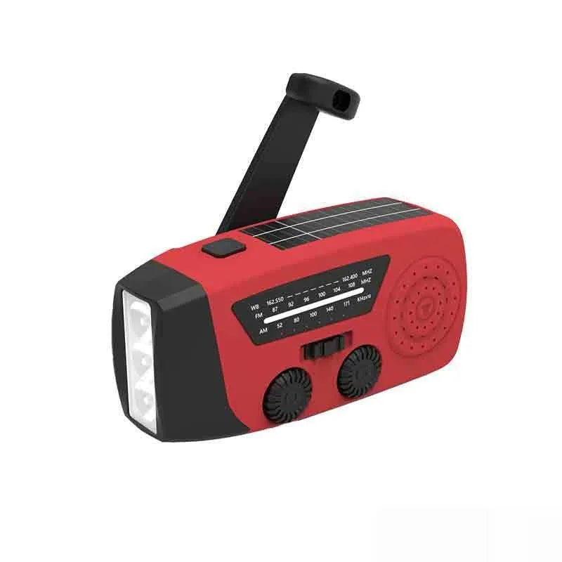 Red emergency rechargeable hand radio torch with wrist strap showing USB port and control buttons