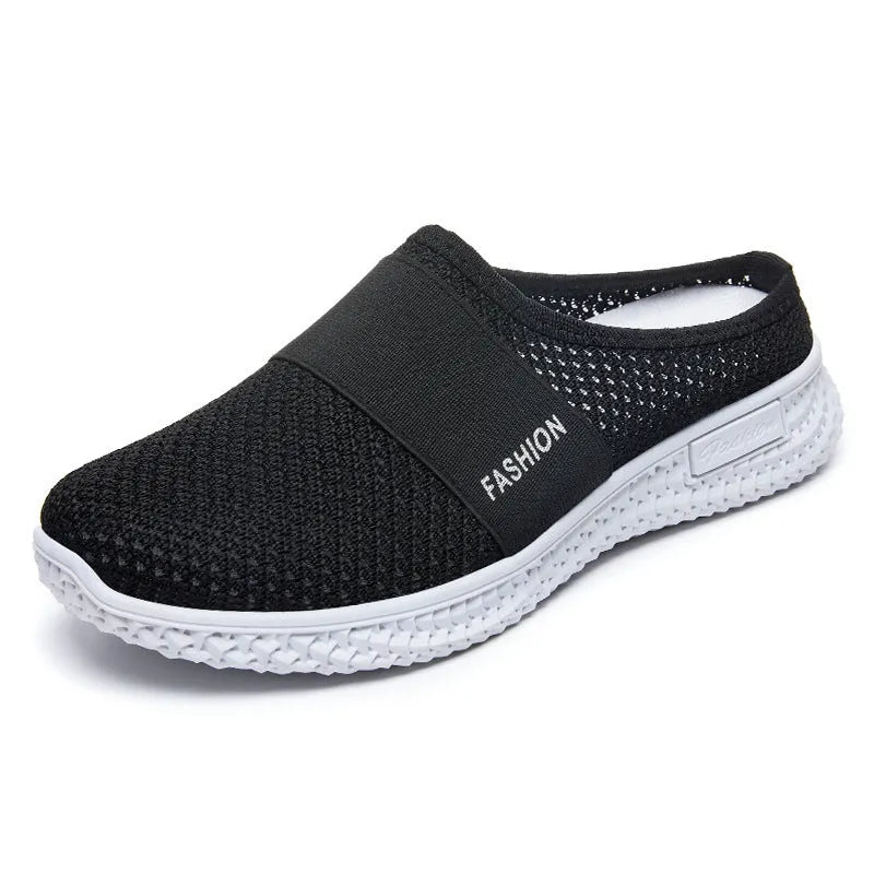 Women's breathable mesh casual shoes in black with a hollow out design and flat heel.