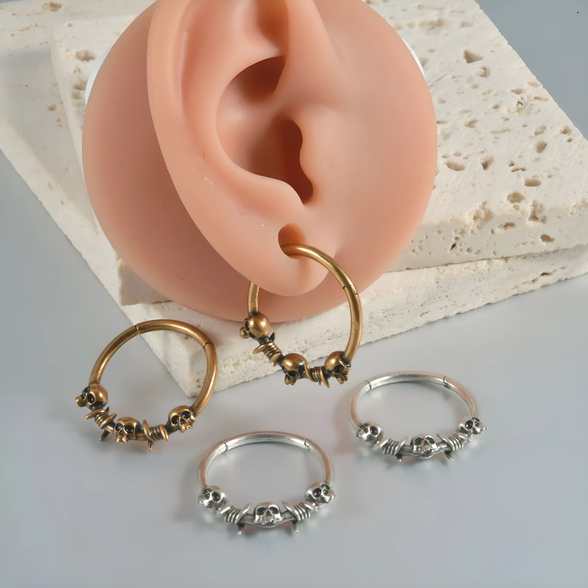 Copper punk-style earrings featuring a ghost head motif in antique silver or gold finish.