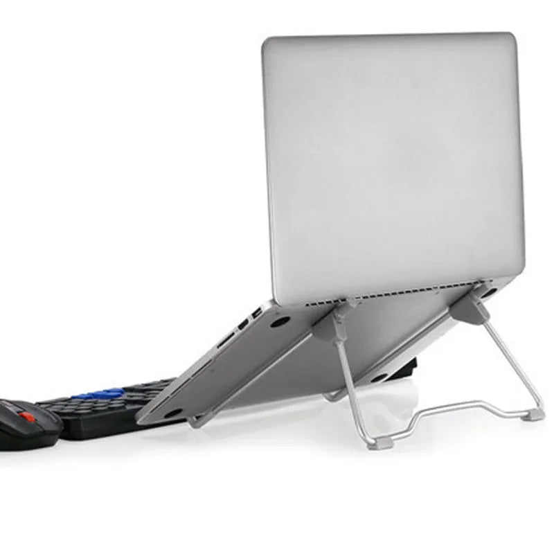 Grey aluminium alloy mobile phone stand with adjustable angle, holding a smartphone