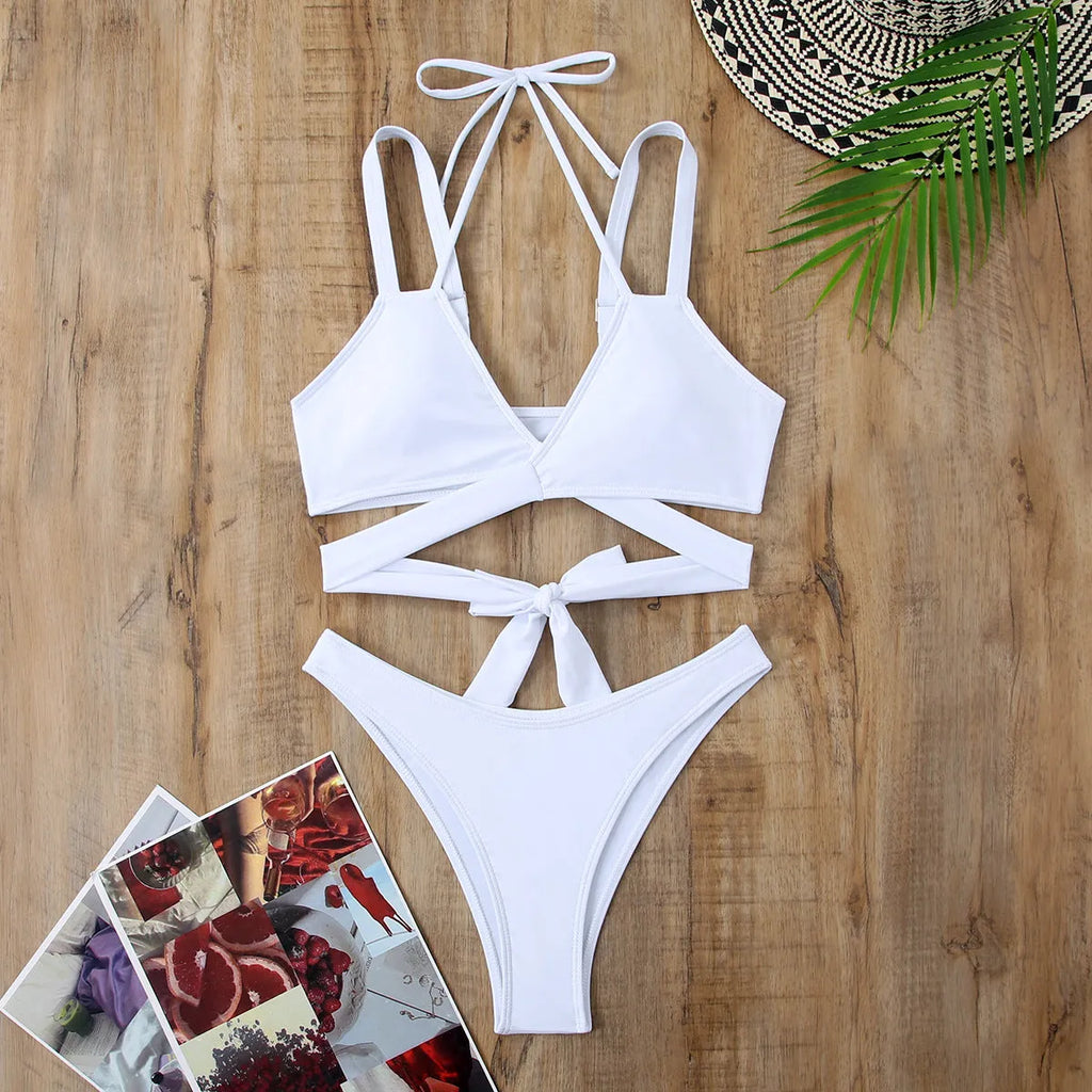 Solid colour women's bikini swimsuit on hanger showing sleeveless design and briefs style