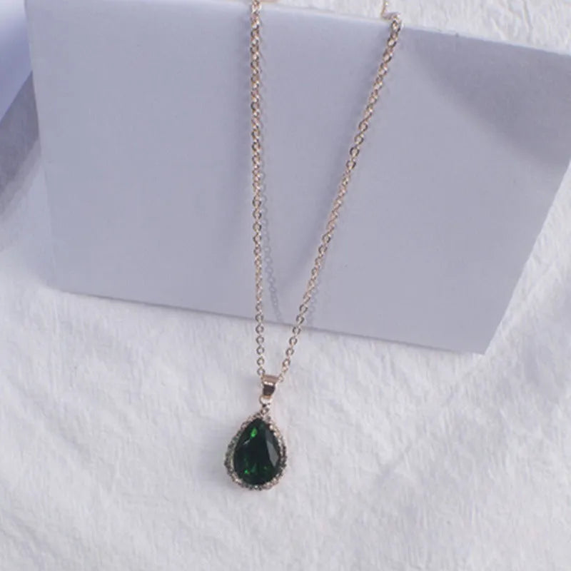 Women's rose gold drop shape necklace with rhinestone details on an alloy chain.