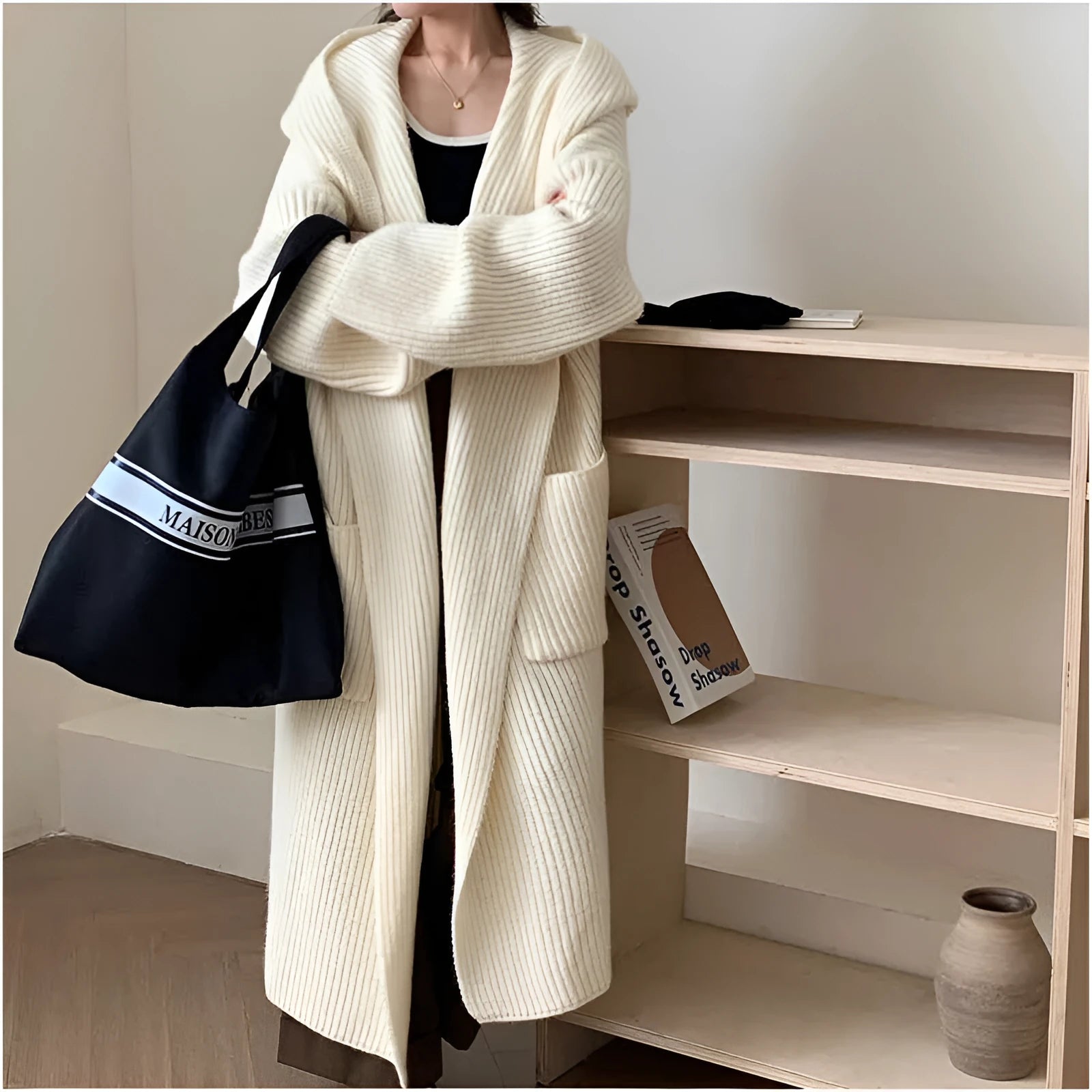 Women's loose hooded cardigan coat in acrylic fabric with raglan sleeves showing front opening