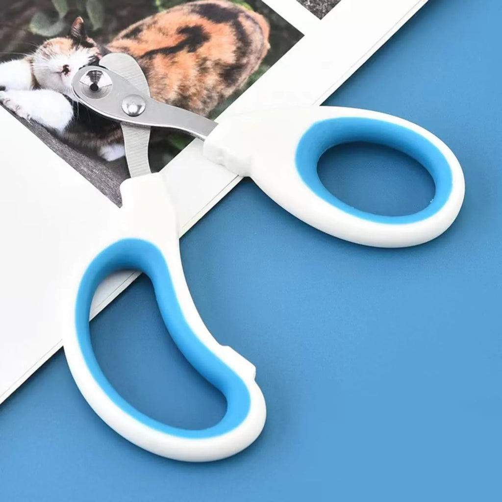 Blue pet nail clippers with circular hole design and cushioned non-slip handle on a white background.