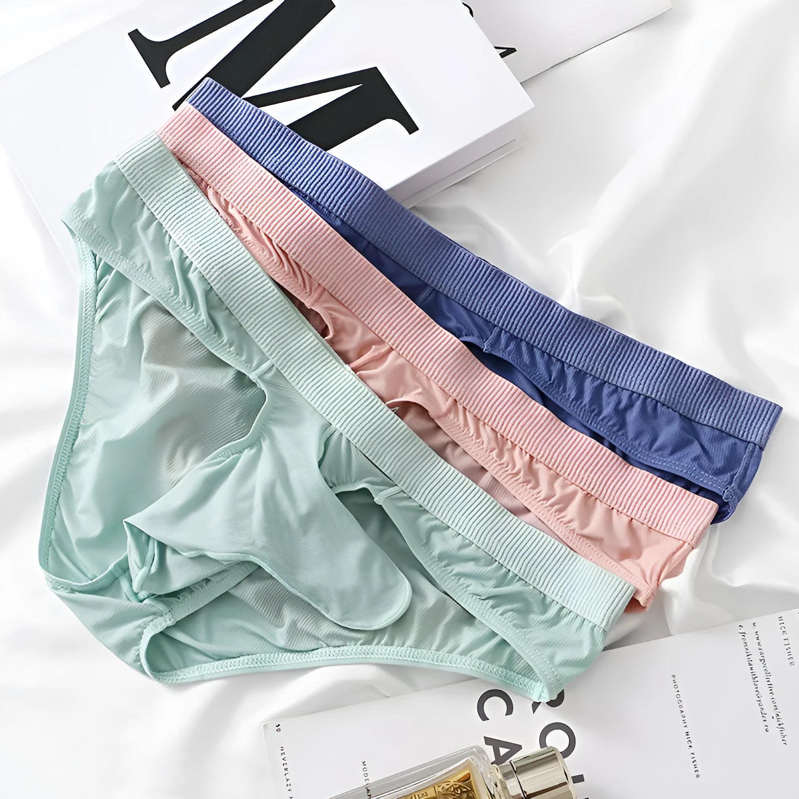 Men's low waist briefs underwear in ice silk fabric showing colour options and briefs style