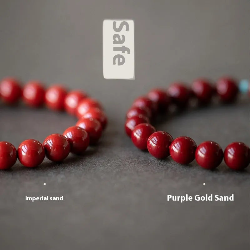 Purple Gold Sand cinnabar Hetian jade bead bracelet in geometric elliptical shape on wrist.