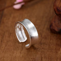 Geometric open ring with frosted silver finish and adjustable opening design