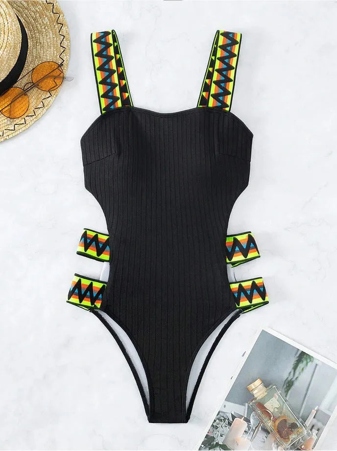 Women's solid black one-piece swimming suit bikini on a mannequin