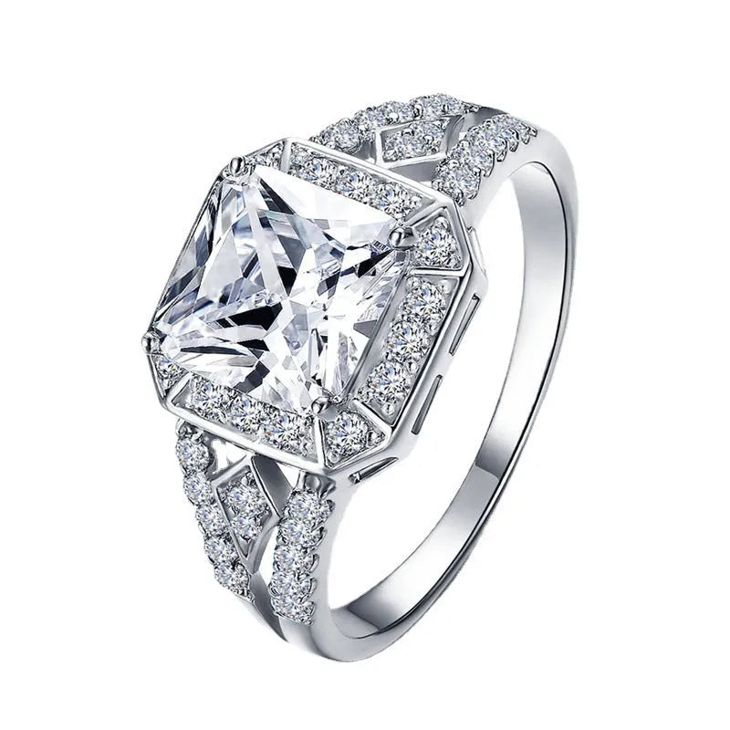 Geometric women's zircon ring with hollow ornamentation in platinum colour