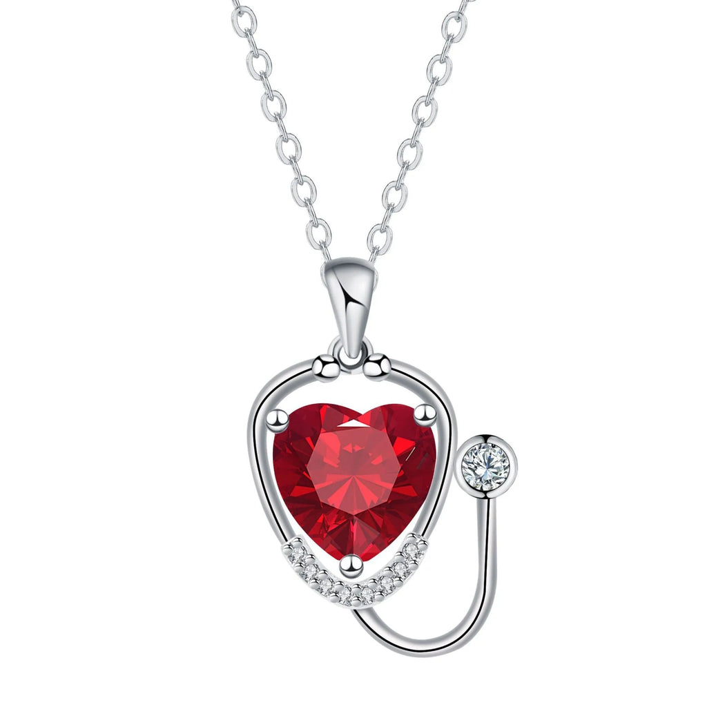Copper stethoscope necklace for women with red diamond wing pendant on a long chain
