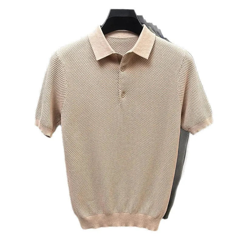 Man wearing a loose grey cotton short sleeve pullover sweater for casual leisure.