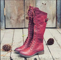 Women's black chunky heel high-leg casual boots with a round toe and rubber sole.