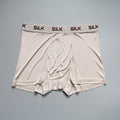 Men's loose-fit silk shorts in navy blue on a mid-waist, showing casual style.
