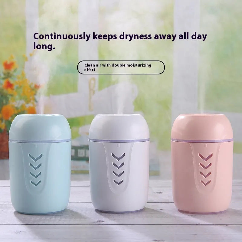 Round desktop air purifier with aromatherapy in blue, showing single fog outlet and USB cable