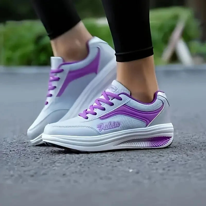 Women's grey heelless sports shoes with a mid-heel, shown alongside black and pink colour options.