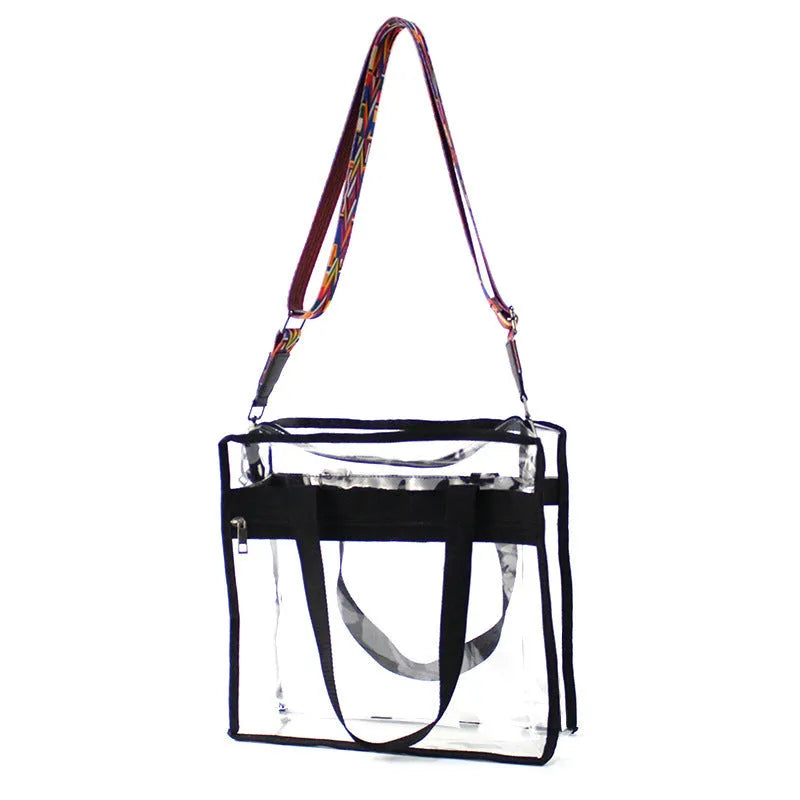 Women's transparent PVC shoulder messenger bag showing front organisation and double strap connector