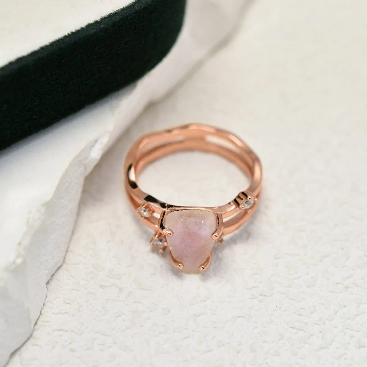 S925 silver geometric ring with irregular triangle design and moonstone, shown in rose gold finish.