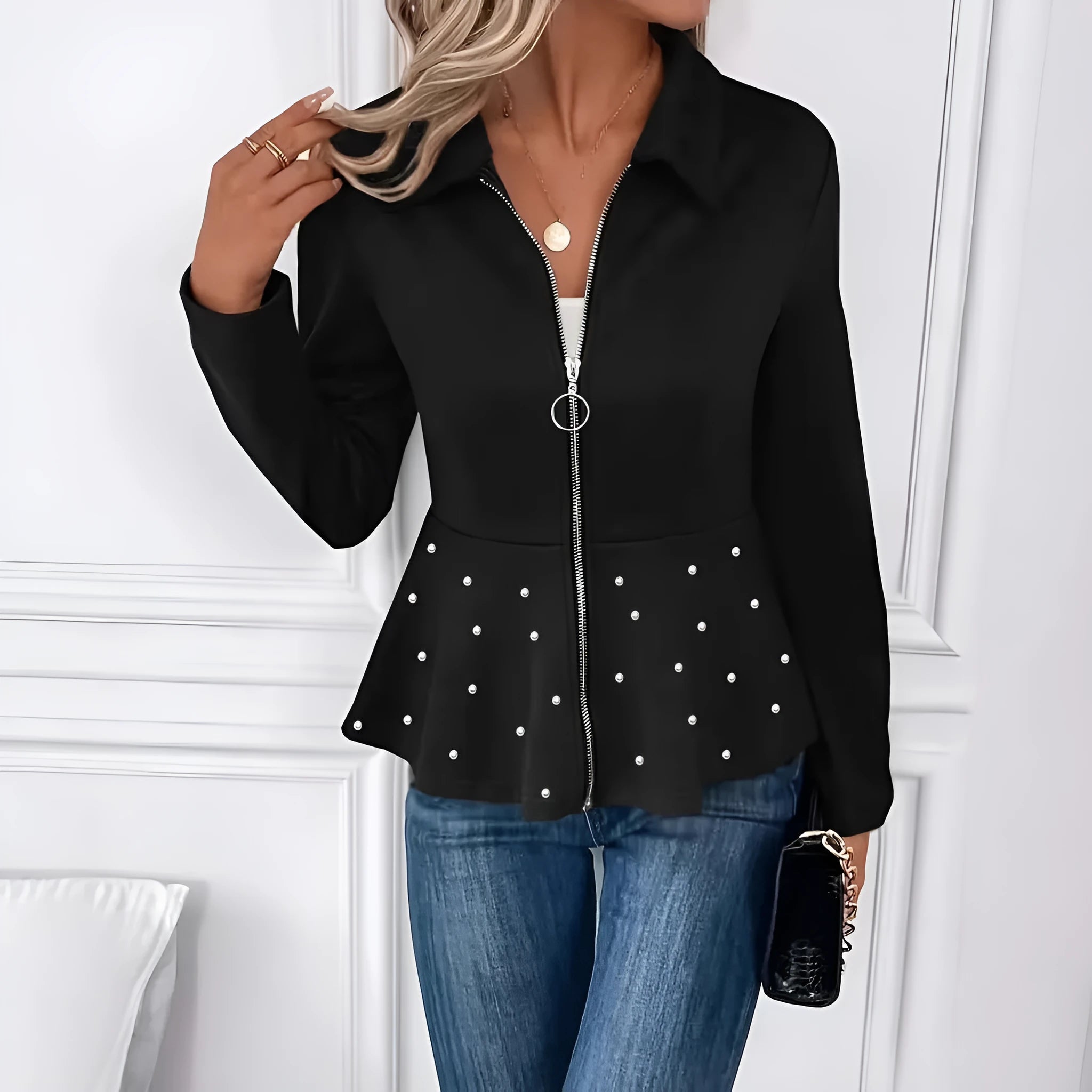 Women's black loose fit coat with heavy-duty zipper and ruffled hem, made from Spandex fabric.