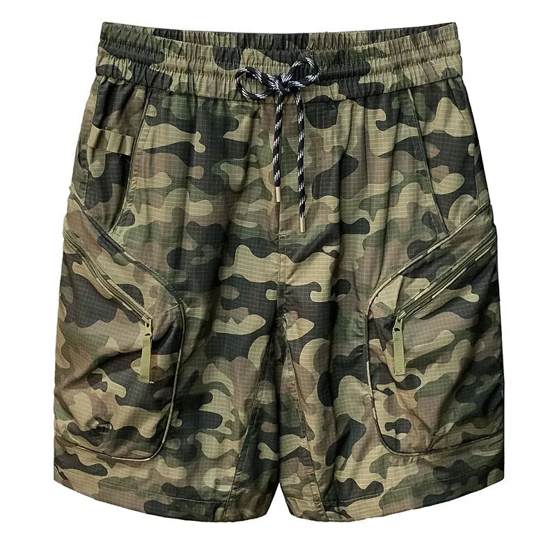 Man wearing loose-fit camouflage cargo shorts made from a cotton blend fabric.