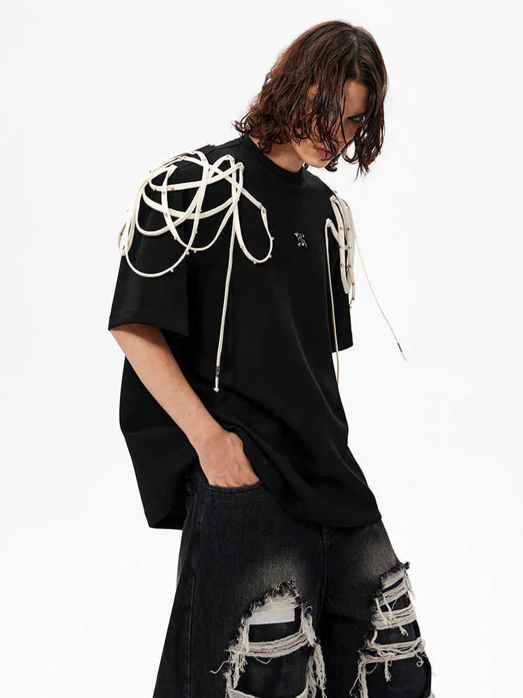 Black loose fit t-shirt with rivet ribbon padded shoulders and round neck collar