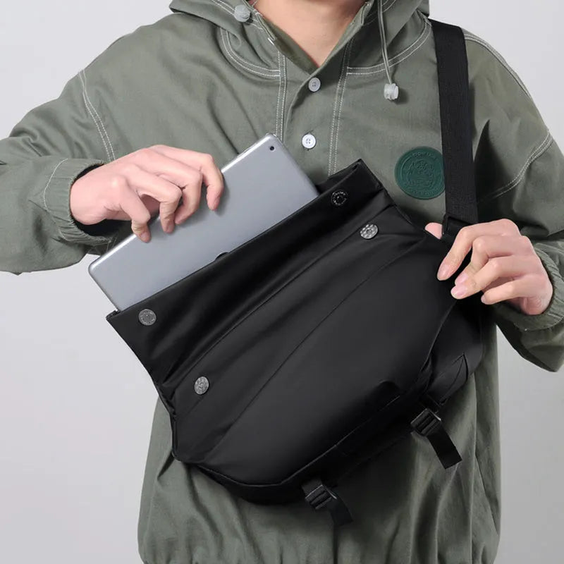 Grey horizontal square PU leather crossbody bag for men with a single shoulder strap.