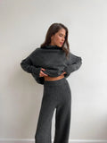 Women's side-slit acrylic sweater suit with matching trousers in solid colour options