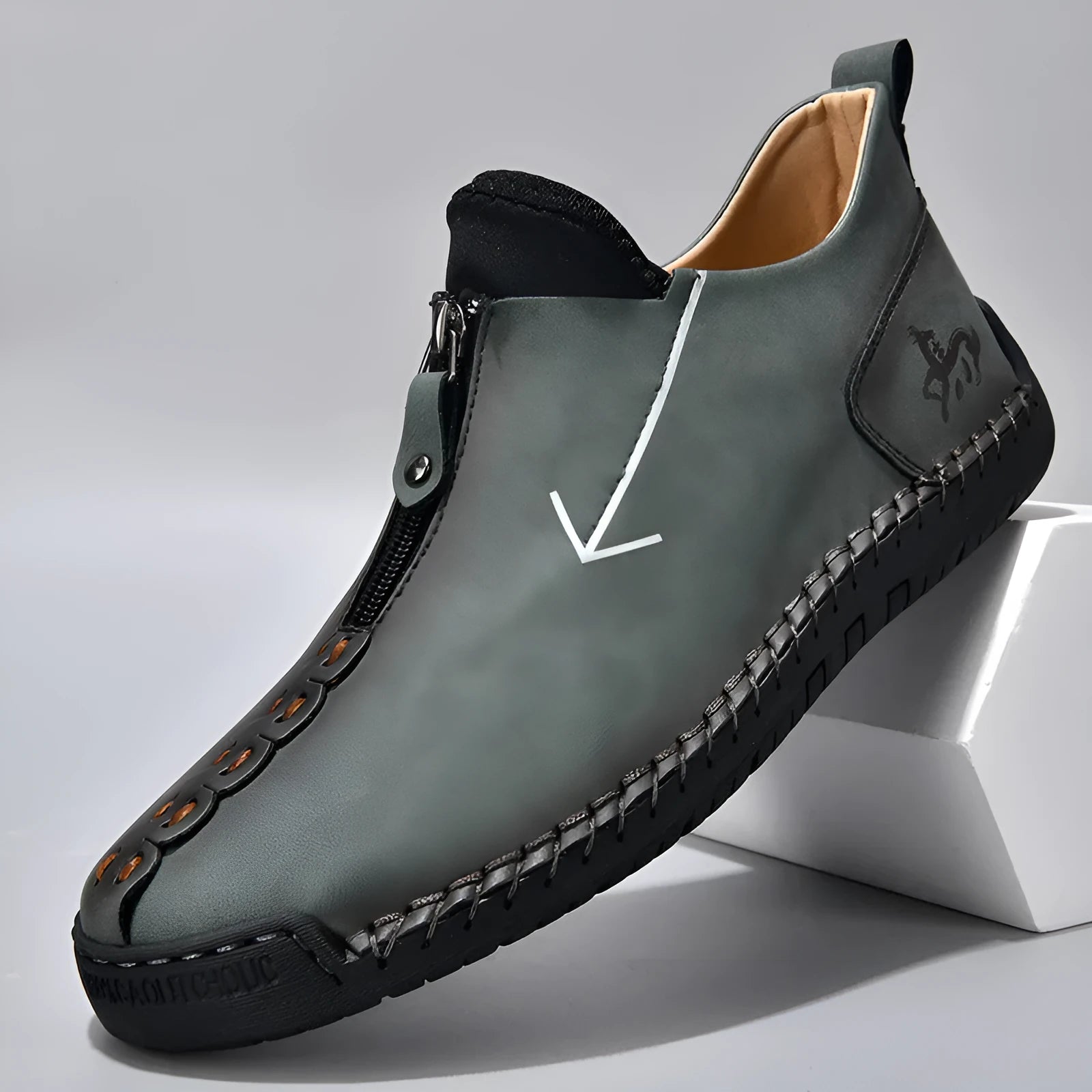 Men's black leather boots with front zipper and hand-stitched detailing on round toe
