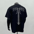 Men's black loose fit short sleeve cotton t-shirt with a print, laid flat.