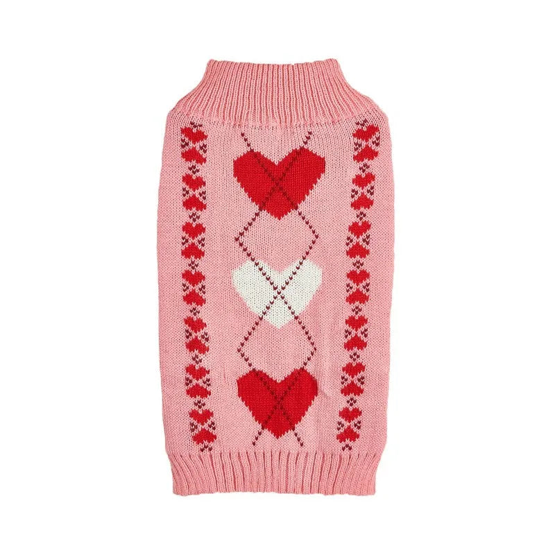 Dog wearing red love heart and pink bow decorated acrylic sweater