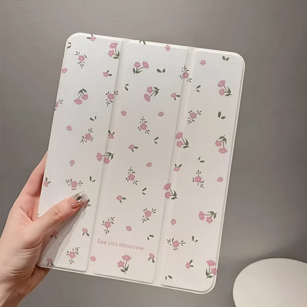 Transparent floral tri-fold hard case for iPad showing magnetic closure and stylus loop.