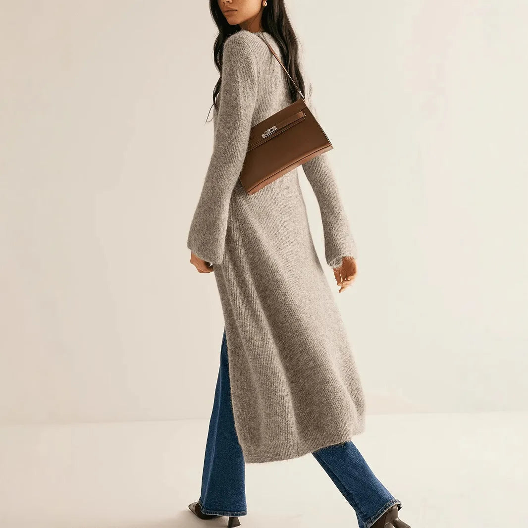 Retro French style long sleeve cardigan coat in khaki with button front on a woman, soft acrylic and viscose blend