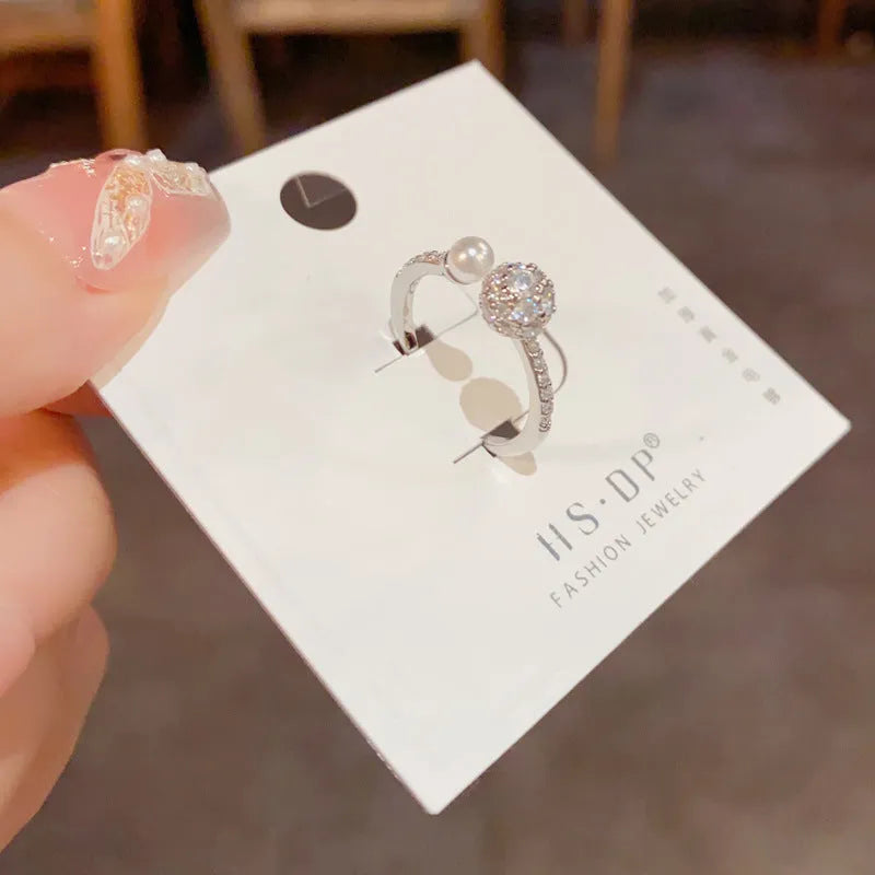Adjustable open-end ring with round zircon pearl design in gold and silver colours