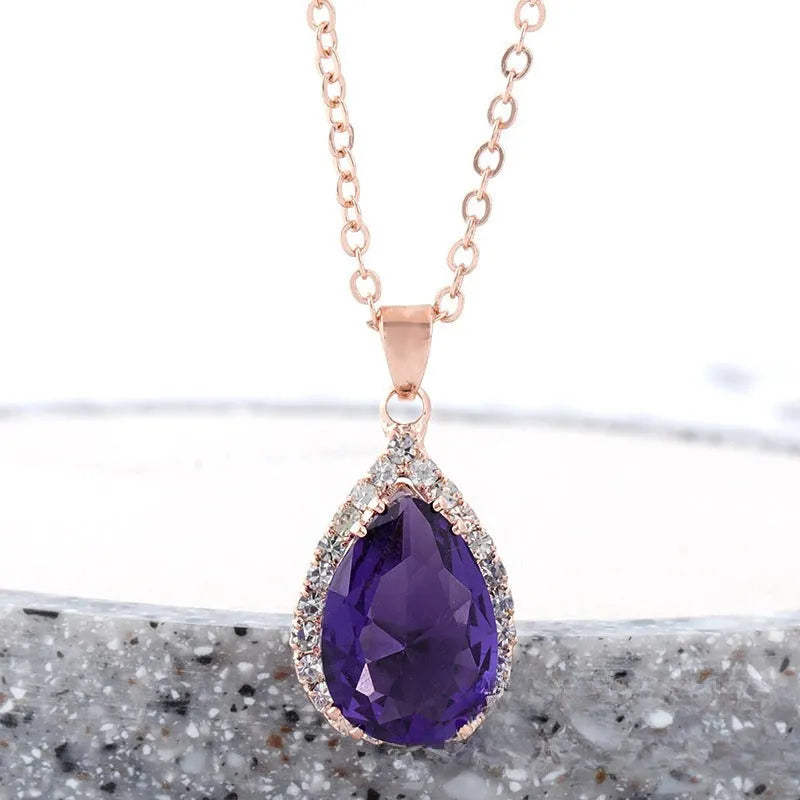Women's rose gold drop shape necklace with rhinestone details on an alloy chain.